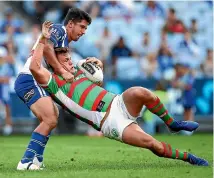  ?? GETTY IMAGES ?? Liam Knight of the Rabbitohs is scragged to the ground during his team’s 14-6 win over the Bulldogs in Sydney last night.
