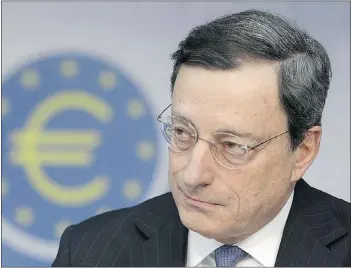  ?? — BLOOMBERG ?? Mario Draghi, president of the European Central Bank, announces a hold on interest rates after two straight cuts, signalling a respite from the sovereign-debt crisis.