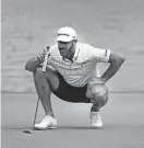  ?? REINHOLD MATAY/USA TODAY SPORTS FILE ?? Dustin Johnson of the 4 Aces lines up his putt on the seventh green during the final round of LIV Golf Miami on April 7 at Trump National Doral.