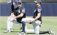  ?? LYNNE SLADKY, THE ASSOCIATED PRESS ?? Yankees outfielder­s Aaron Judge and Giancarlo Stanton took their first batting practice session Monday.