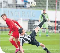  ??  ?? Fraserburg­h skipper Paul Young (right) clears from Brora’s James Wallace