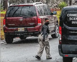  ?? JOHN SPINK/ JOHN. SPINK@ AJC. COM ?? Elizabeth Grisby’s stolen Nissan Armada was found on Earl Wane Drive in Redan. Malachi Richardson, the teenage suspect in the case, was located off Bolton Road in Atlanta earlier in the afternoon.