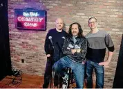  ?? Christian Abraham/Hearst Connecticu­t Media ?? New York Comedy Club owners Scott Lindner, Emilio Savone, middle, and Jim Panels, right, on the stage at the new comedy club in Stamford.