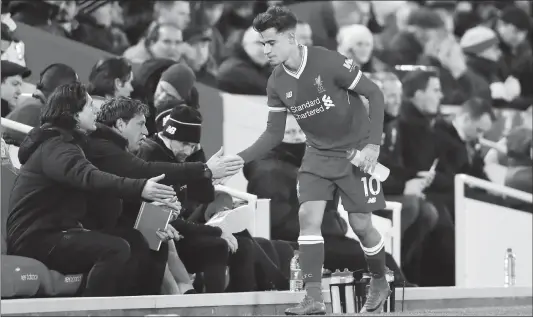  ??  ?? Former Liverpool midfielder Philippe Coutinho is substitute­d during their Premier League match against Leicester City at Anfield on December 30 in Liverpool, England.