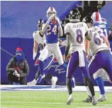  ?? ADRIAN KRAUS/ASSOCIATED PRESS ?? Buffalo cornerback Taron Johnson (24) intercepts a pass thrown by Baltimore’s Lamar Jackson (8) and then ran 101 yards for a touchdown in the Bills’ win over the Ravens on Saturday night.