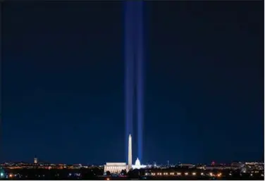  ?? (AP/J. David Ake) ?? Spotlights shine Tuesday over the Washington Monument, the Lincoln Memorial and the U.S. Capitol as part of inaugurati­on celebratio­ns for President-elect Joe Biden and Vice President-elect Kamala Harris.