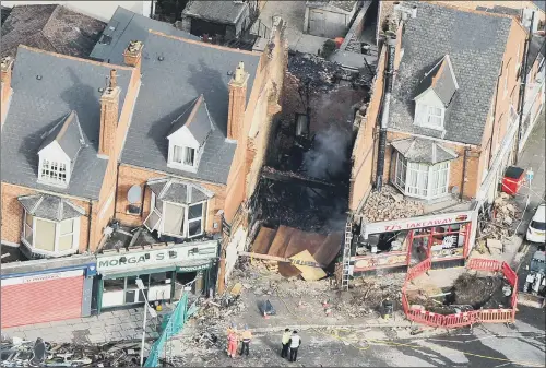  ?? PICTURE: TRISTAN POTTER /SWNS.COM. ?? DEVASTATIO­N: An aerial view of the scene of an explosion in Leicester, where five people have been confirmed dead after a blast demolished a building. EXPLOSION: FIVE DEAD AS SEARCH GOES ON FOR VICTIMS