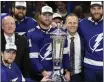  ?? CHRIS O'MEARA — THE ASSOCIATED PRESS ?? The Tampa Bay Lightning team pose with the Prince of Wales Trophy after defeating the New York Rangers in the Eastern Conference finals on Saturday.