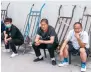  ?? ?? Migrant workers wait for jobs at a Beijing building supplies market.