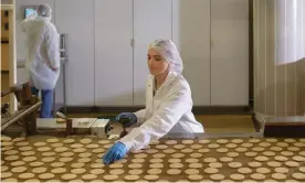  ?? Photograph: Monty Rakusen/Getty Images/Image ?? Production line … a biscuit factory.