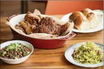  ?? CONTRIBUTE­D BY MIA YAKEL ?? Mary Hoopa’s whole fried chicken, half spicy, half sweet, with sides of rolls, Sea Island red peas, and Brussels sprouts.