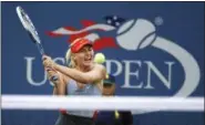  ?? JASON DECROW — THE ASSOCIATED PRESS FILE ?? In this file photo, Maria Sharapova, of Russia, returns a shot to Alexandra Dulgheru, of Romania, during the second round of the U.S. Open tennis tournament, in New York. Sharapova has been granted a wild-card invitation for the U.S. Open’s main draw....