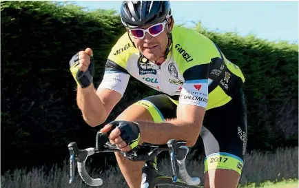  ?? PHOTO: FAIRFAX NZ ?? Craig Harper celebrates as he rides into Invercargi­ll, setting a record for fastest person to cycle the length of New Zealand.