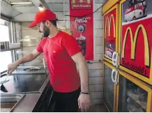  ?? VAHID SALEMI/ THE ASSOCIATED PRESS ?? A knock- off version of McDonald’s — “Mash Donald’s” — exists in Tehran. Its owner welcomes competitio­n.