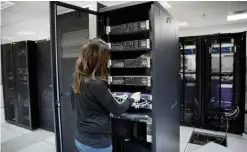  ??  ?? RAMALLAH: In this Nov. 19, 2015 file photo, a technician works in the servers unit at the headquarte­rs of the Palestinia­n cellular network Jawwal, in the West Bank city of Ramallah. After years of delays, Israel said Thursday that it would allow the...