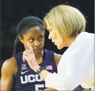  ?? Dave Crenshaw / Associated Press ?? UConn associate head coach Chris Dailey, right, talks with Crystal Dangerfiel­d during a game at Tulsa.