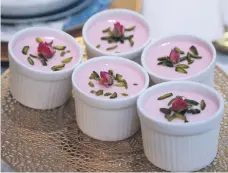  ?? Victor Besa / The National ?? Pots of rose falooda dessert are among the delicacies on the family’s iftar table