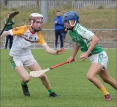  ??  ?? Naomh Eanna’s Darragh Canavan is faced by Eoin McDonnell.