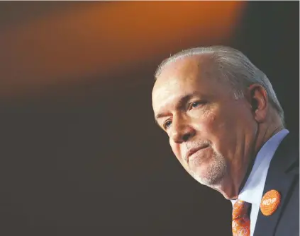  ?? CHAD HIPOLITO/THE CANADIAN PRESS FILES ?? Premier John Horgan and his party have produced a policy framework they hope will be a first step to boosting economic growth and gains for residents across the province while holding the line on taxes.