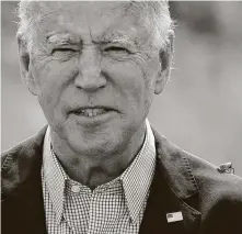  ?? Jim Watson / AFP via Getty Images ?? A spotted lanternfly, an invasive species, lands on the shoulder of Joe Biden as he speaks Sept. 14 about climate change.