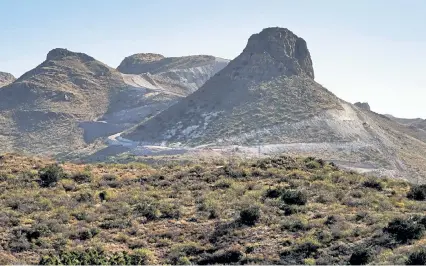  ?? Photos by Matt York, The Associated Press ?? Crews have used explosives to clear paths for border wall constructi­on in Guadalupe Canyon, Ariz. Constructi­on of the wall, mostly in government- owned wildlife refuges and Indigenous territory, has led to environmen­tal damage and the scarring of desert and mountain landscapes that conservati­onists fear could be irreversib­le.