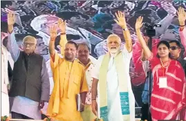  ??  ?? ■ Uttar Pradesh governor Ram Naik (left), chief minister Yogi Adityanath and Prime Minister Narendra Modi with other BJP leaders at a public meeting in Mirzapur on Sunday. RAJESH KUMAR/HT