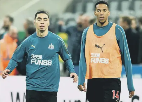  ??  ?? Isaac Hayden warms up with Newcastle’s record signing Miguel Almiron.