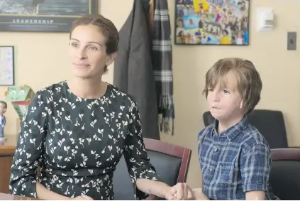  ??  ?? Jacob Tremblay stars as Auggie, a boy born with a severe facial deformity. Julia Roberts portrays his mother in Wonder.