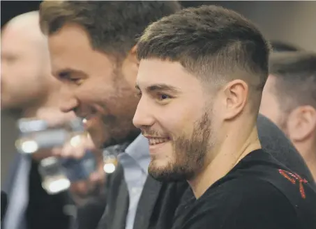  ??  ?? Josh Kelly, here enjoying a joke with promoter Eddie Hearn, is relishing his big date against Kris George. Picture by Stu Norton.