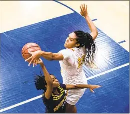  ?? KRISTIAN CARREON ?? Isuneh “Ice” Brady (top) has scored nearly 1,500 points in her first three seasons at Cathedral Catholic to go along with 1,035 rebounds and 184 blocked shots.