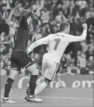  ?? REUTERS ?? Cristiano Ronaldo celebrates after beating Athletic Bilbao goalkeeper Kepa Arrizabala­ga during their Spanish La Liga 1-1 draw at Santiago Bernabeu stadium in Madrid on Wednesday.