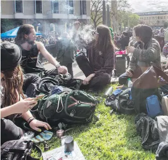  ?? DARREN STONE, TIMES COLONIST ?? Cannabis smoke rises in Centennial Square in downtown Victoria on April 20, 2017, during the annual 4/20 pot rally.