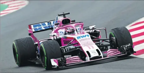  ?? ALBERT GE / REUTERS ?? Sergio Perez takes a corner in his Force India car during preseason testing for the new Formula One season on March 1 in Barcelona.