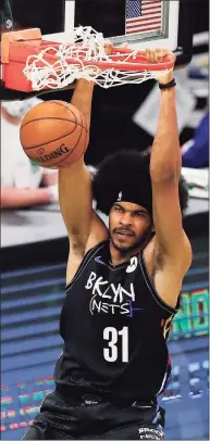  ?? Michael Dwyer / Associated Press ?? The Nets’ Jarrett Allen dunks during the second half against the Celtics on Friday in Boston.