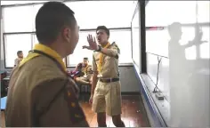  ??  ?? Rapper Elevenfing­er, 17, (right) engaging a student in a rap battle during a music club session at a government school in Bangkok. — AFP photos