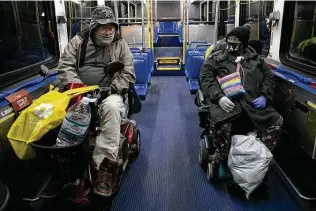  ?? Lisa Krantz / Staff photograph­er ?? Timothy Arnold, 60, and Beverly Grady, 68, both on electric scooters, were among Fair Avenue Apartments residents to be moved to a hotel after days without power and water.