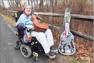  ?? Arnold Gold / Hearst Connecticu­t Media ?? Disability rights activist and singer/songwriter Elaine Kolb outside her home in West Haven on Friday.