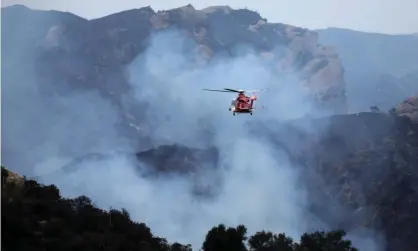  ??  ?? Firefighte­rs continue to battle the Palisades fire in Los Angeles on 16 May. Photograph: Gary Coronado/Los Angeles Times/REX/Shuttersto­ck