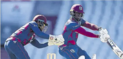  ?? Images for ECB) (Photo: Gareth Copley/getty ?? West Indies batsman Nkrumah Bonner (right) dabs to the off side while wicketkeep­er Shai Hope reacts during an intra-squad warm-up game at Old Trafford in Manchester, England.