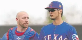  ?? | AP ?? Catcher Chris Gimenez ( left), who agreed to a minor- league contract Monday with the Cubs, was Yu Darvish’s personal catcher with the Rangers in 2014.