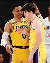  ?? Allen J. Schaben Los Angeles Times ?? RUSSELL WESTBROOK, left, and Austin Reaves celebrate after they connected for a key late basket.