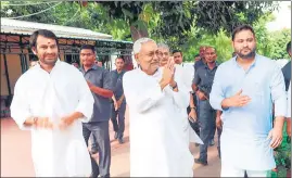  ?? ANI ?? JD (U) leader Nitish Kumar with RJD leaders Tejashwi Yadav and Tej Pratap.