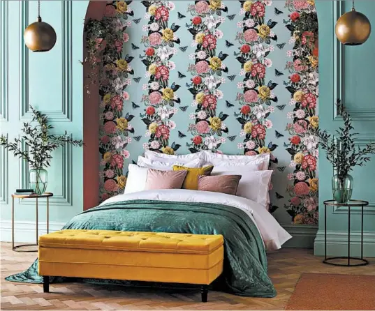  ?? GRAHAM BROWN/AP ?? Graham & Brown’s Lancashire wallpaper is a lush country garden floral print on a pale green background.