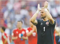  ?? DAVID VINCENT/ASSOCIATED PRESS ?? Denmark goalkeeper Kasper Schmeichel applauds supporters after the match.