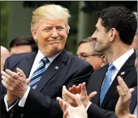  ?? AP/ EVAN VUCCI ?? President Donald Trump celebrates with House Speaker Paul Ryan in the White House Rose Garden after the House passed the health care bill Thursday.