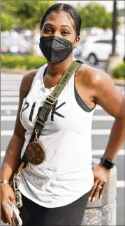  ?? PHOTOS BY NATRICE MILLER/NATRICE.MILLER@AJC.COM ?? “My whole family still wears masks,” said Nickie Tingle, 38. She said Black people “were the most infected when it first happened, and it made us want to protect ourselves.”