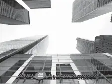  ?? CANADIAN PRESS PHOTO ?? A Bank of Montreal sign is shown in the financial district in Toronto on Tuesday, August 22, 2017. BMO is warning that “fraudsters” from outside of the country may have accessed certain personal and financial informatio­n of some of its customers.