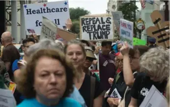  ?? BRYAN R. SMITH/AFP/GETTY IMAGES FILE PHOTO ?? Protesters filled the street during a health-care rally in front of Trump Tower in New York City on Saturday.