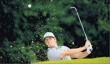  ?? Andrew Redington Getty Images ?? BLASTING OUT on the third hole, Rory McIlroy had one eagle in his round of 67 and just missed another.