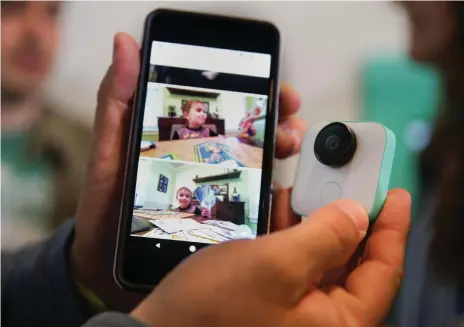  ??  ?? Above, the new Pixel 2 smartphone and Google Clips wireless camera, which looks simple but is capable of identifyin­g potential photo opportunit­ies within its field of vision and shooting seven-second sequences of images for you AFP